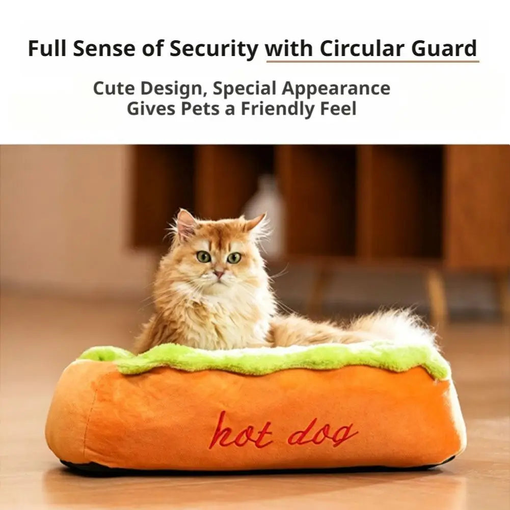 Orange plush hot dog pet bed with green faux lettuce trim and red embroidered text designed as a resting place and lounger for cats and dogs.
