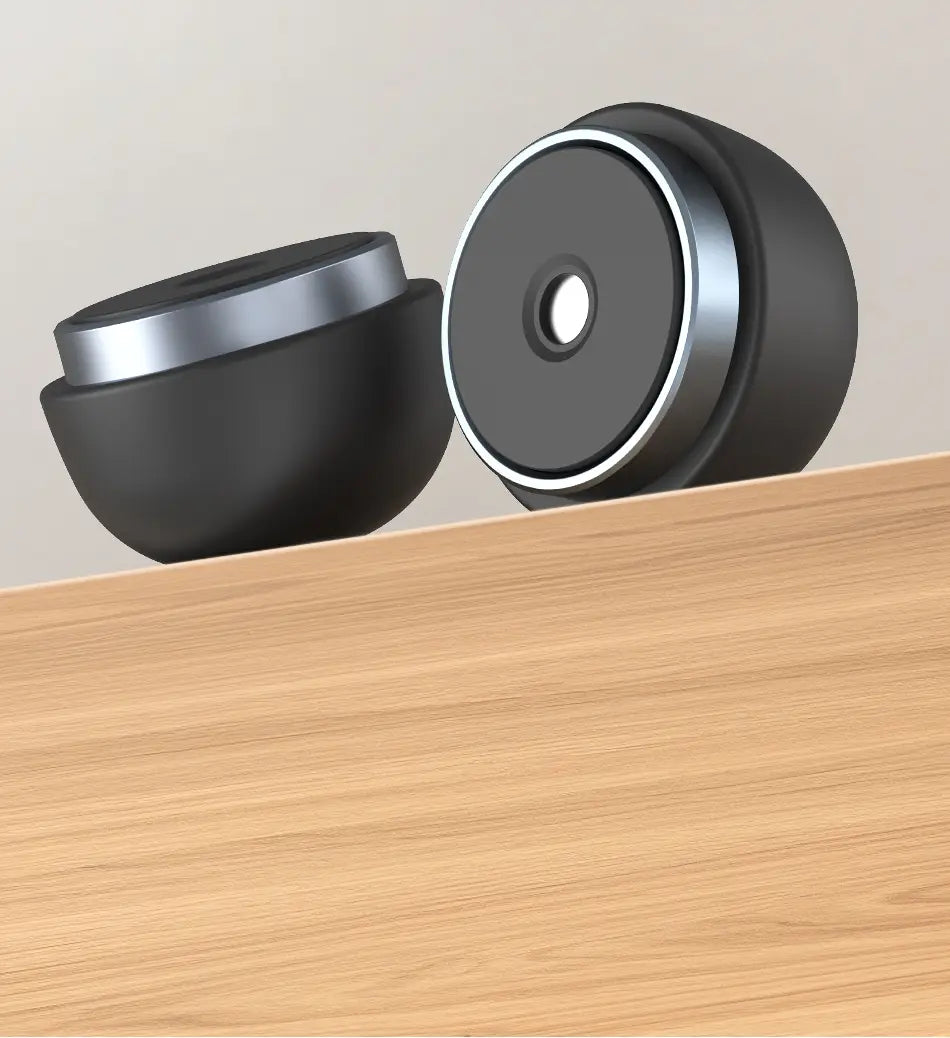 A black and silver magnetic door stop with a sleek modern design shown as part of the Rocoren magnetic laptop stand and cooling holder.