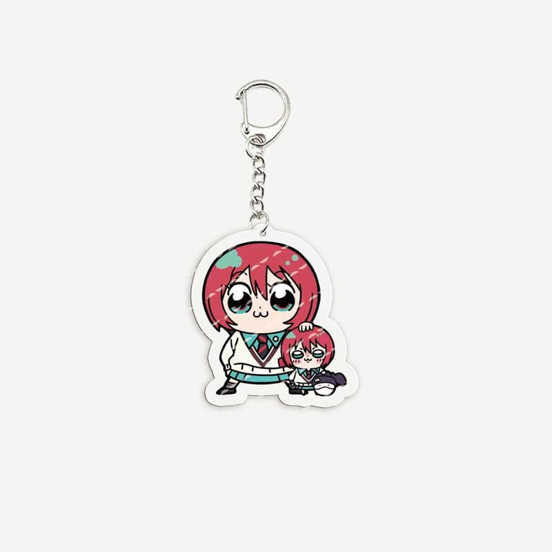 A clear acrylic anime chibi keychain featuring two red-haired characters in school uniforms with one standing and one sitting beside them.