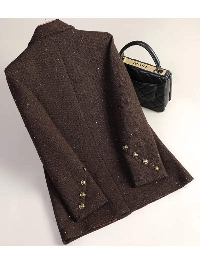 Wool blend double breasted blazer in brown textured fabric with subtle glittery speckles and gold toned button details on the cuffs.