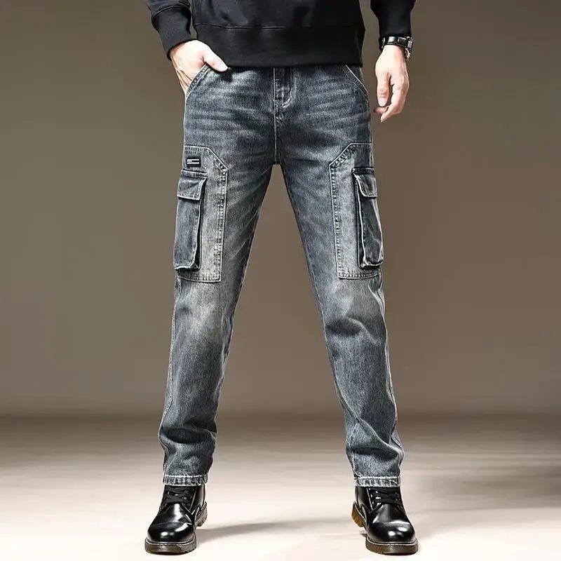 Baggy dark wash denim cargo pants with large flap pockets and a slightly faded, distressed look.