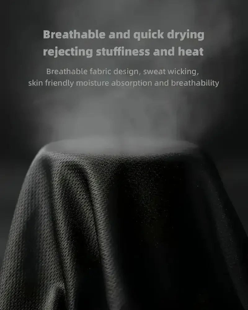 Ensemble de sport deux-pièces pour homme, d’été, dans un tissu texturé gris foncé, avec un design respirant et évacuant l’humidité.