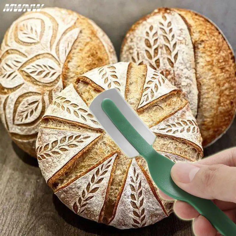Green-handled bread lame stainless steel scoring knife designed for slicing artisan loaves.