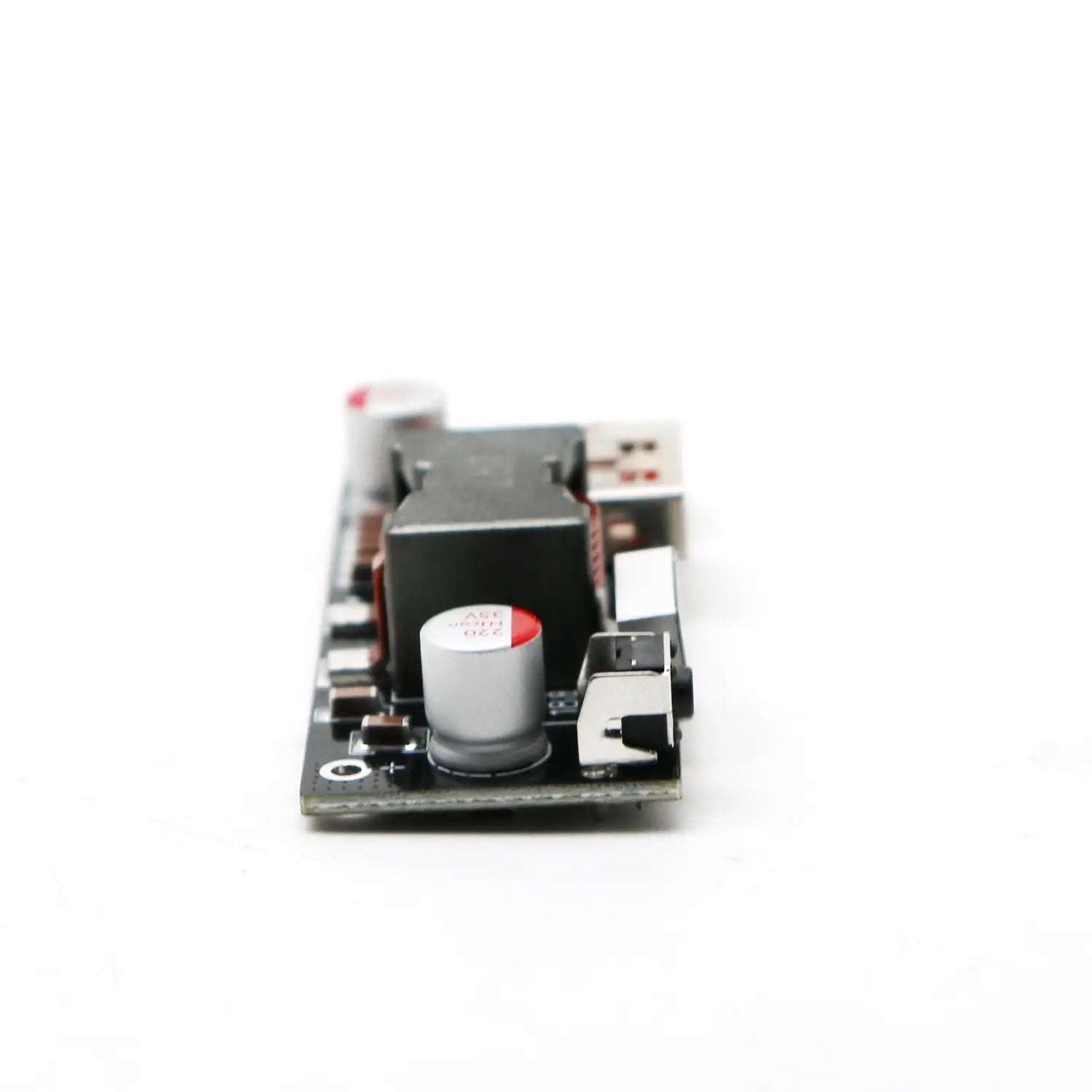 Black circuit board with silver capacitors and a usb port showing the back side of the 100w Pd3.1 fast charger power bank module Bms.