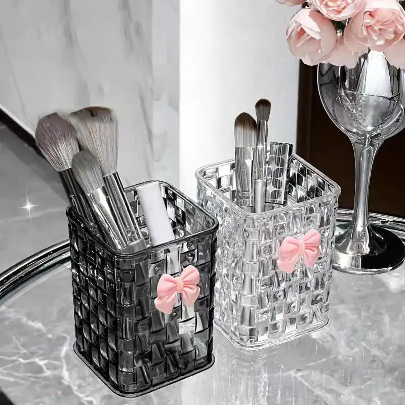 clear and black woven acrylic brush holders adorned with pink bows for desktop pen holder storage organizer use