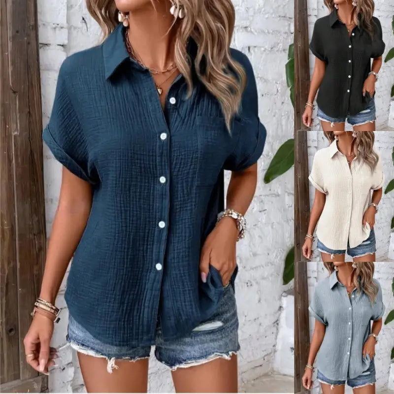 Women cotton short sleeve button up shirt in deep teal with a textured lightweight fabric and rolled cuffs.