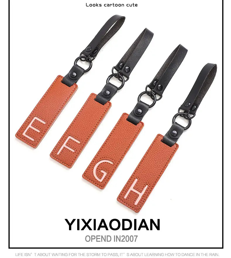Set of four tan leather luggage tags with white embroidered initials e, f, g, and h suitable as letter keychain leather alphabet pendant party gifts.