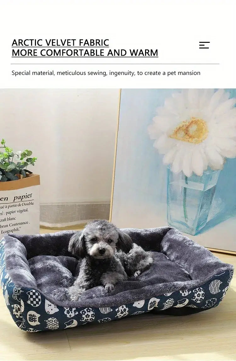 Dark blue arctic velvet cat bed with white animal and patterned trim featuring a plush cozy interior for winter pet products.