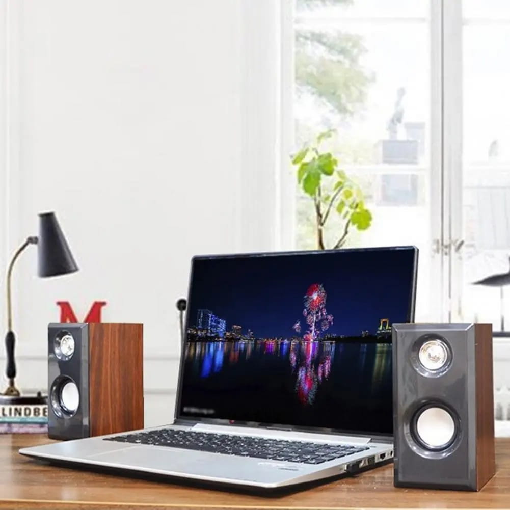 Pair of usb wooden computer speakers with a wooden finish, silver front panels, and circular drivers for surround sound stereo use.