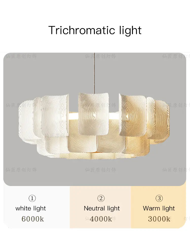 Minimalist wabi sabi led chandelier pendant light featuring a modern trichromatic design with layered textured glass shades in white and gold tones.