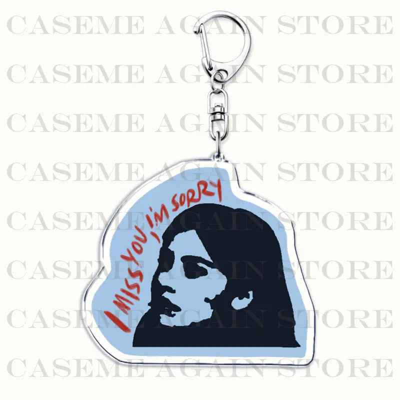 A translucent blue acrylic keychain featuring a black silhouette of a woman’s face with red cursive text i miss you i’m sorry designed as a Gracie Abrams acrylic keychain anime fan gift.