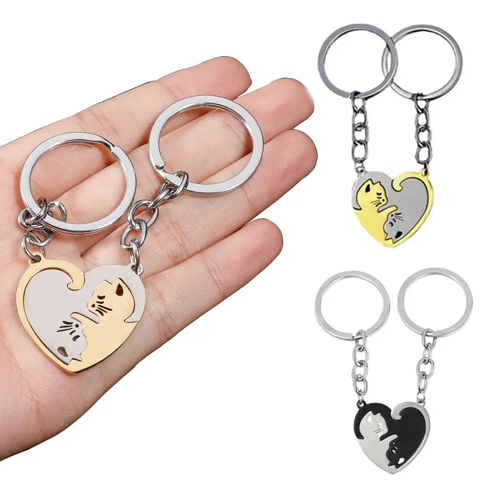 Heart-shaped interlocking cat couple keychain set in gold and silver tones featuring two detailed cat designs with a matching split design for pair bonding.