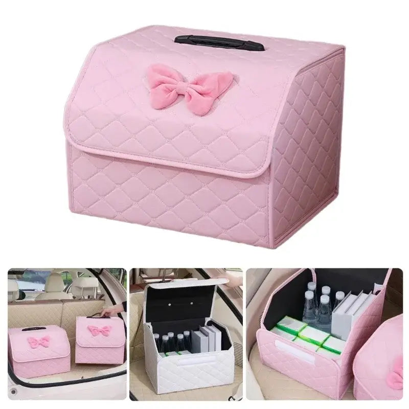 Pink quilted car trunk organizer made of soft fabric with a decorative bow on top.