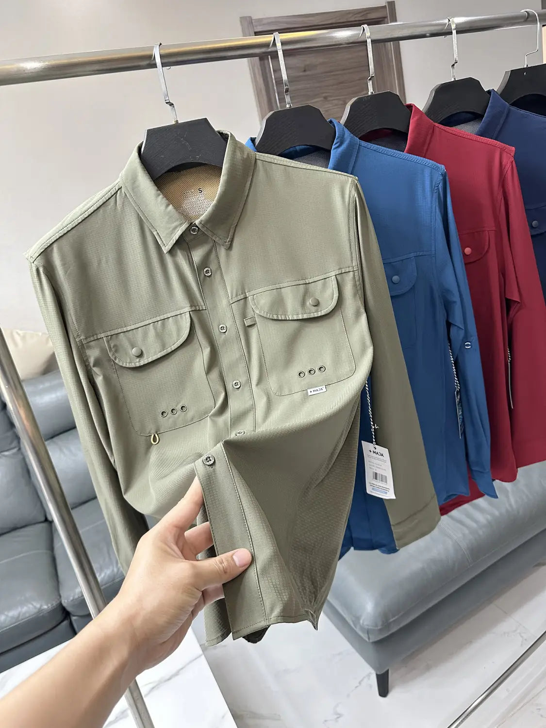Men’s tactical outdoor long sleeve shirt in olive green featuring a subtle textured fabric and two chest pockets.