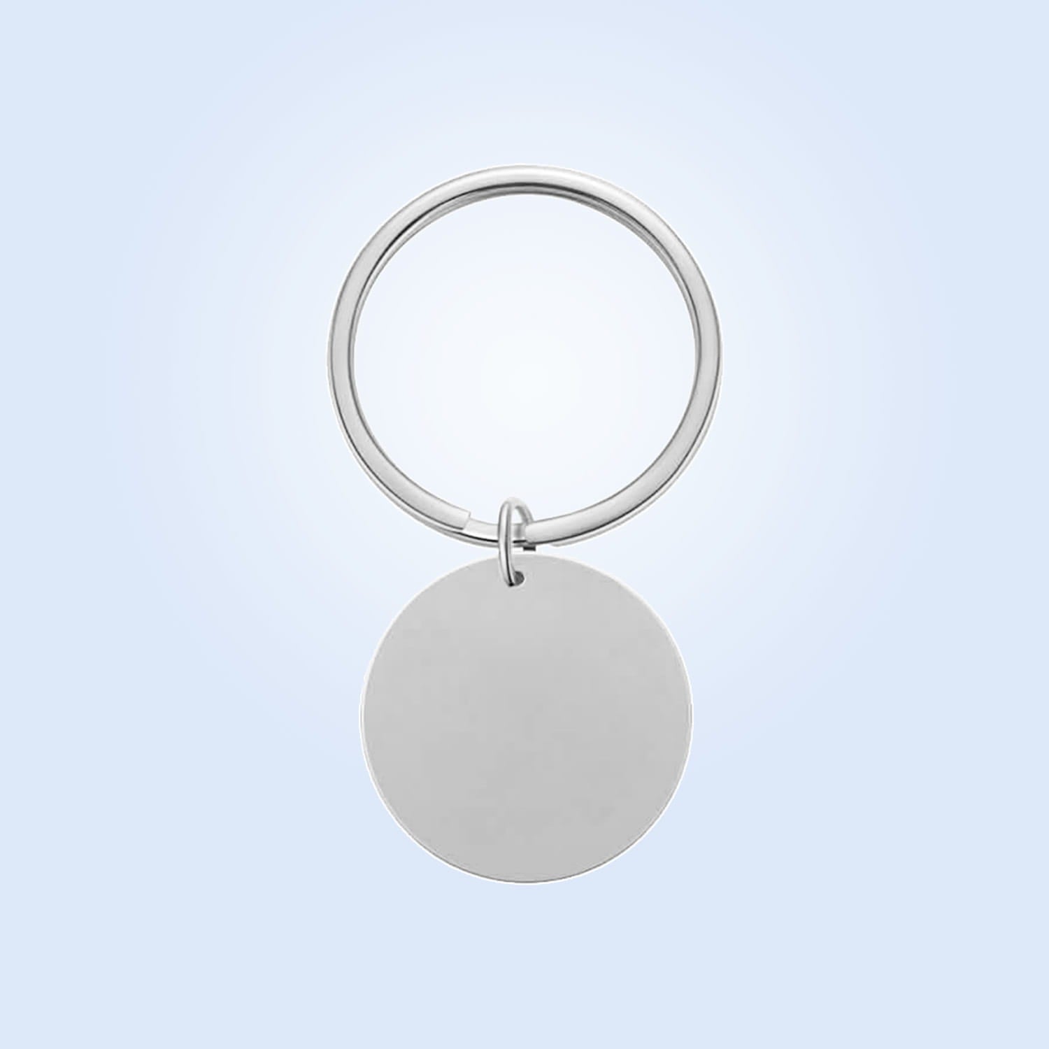 Silver circular keychain made of polished metal with a smooth disc and sleek ring for personalized fingerprint QR code keychain gift.