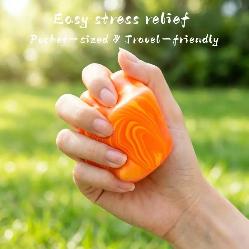 Vibrant orange and yellow marbled marble swirl cube squeeze toy made of soft silicone material designed as a slow rising sensory fidget.