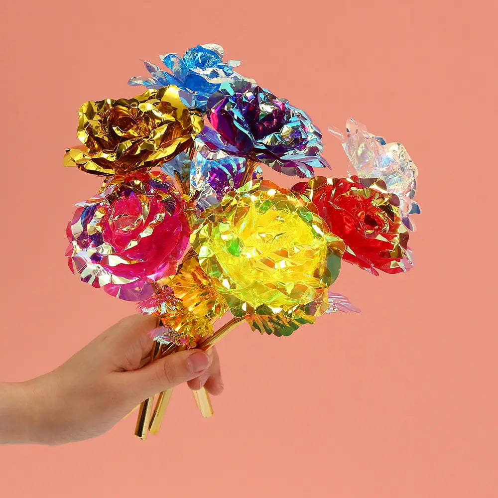A vibrant bouquet of gold foil artificial rose eternal gift flowers in metallic gold pink yellow red and blue hues.