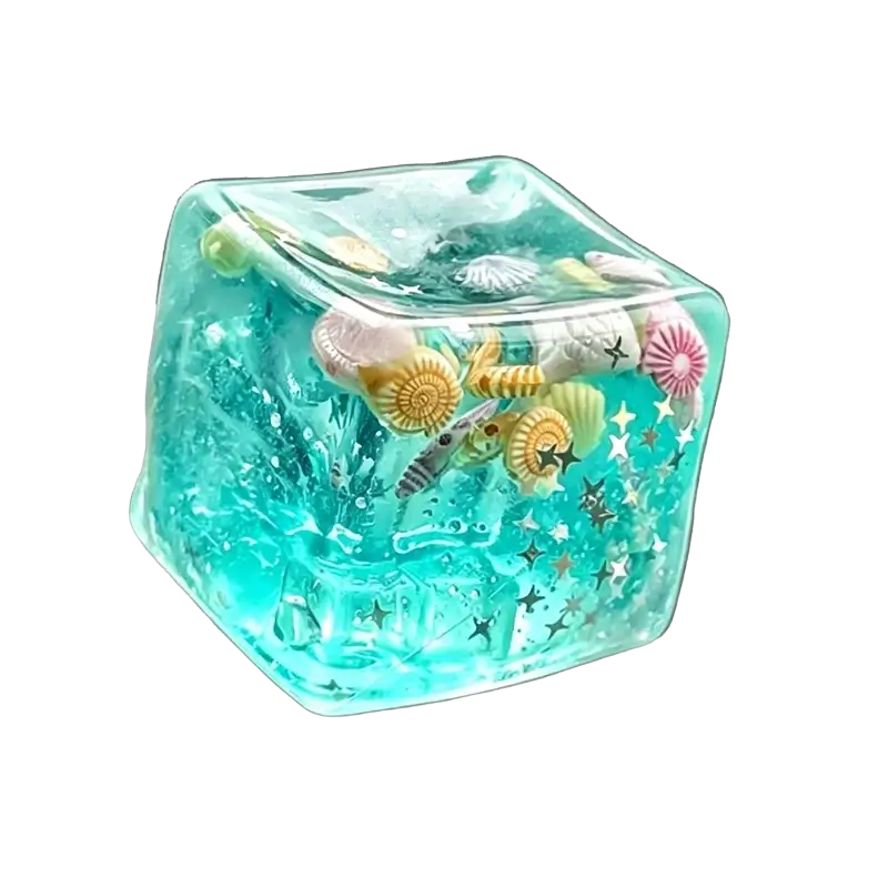 A translucent turquoise swim ocean maltose squishy cube filled with colorful seashells starfish and glittery stars viewed from front
