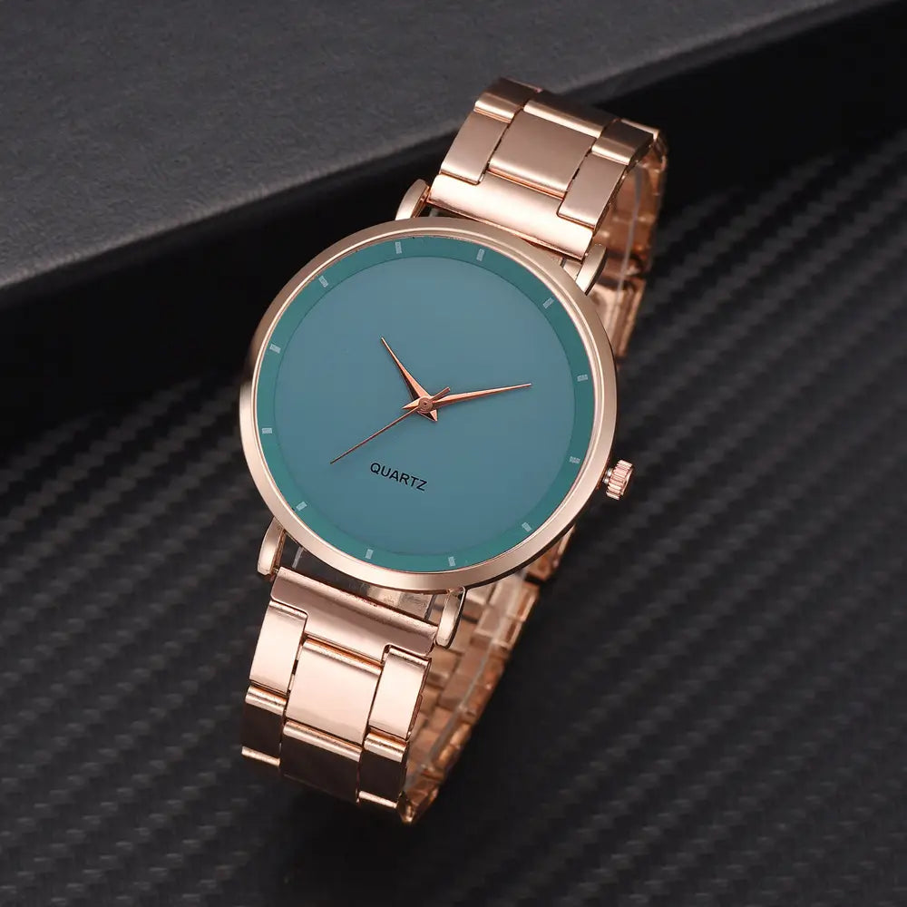 Rose gold women luxury quartz business wristwatch featuring a rose gold-tone stainless steel case with a teal-colored dial and minimalist design.