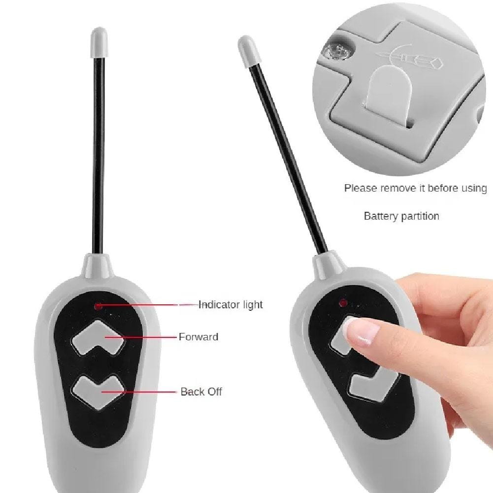 Gray remote control with black directional buttons and thin antenna for mechanical dog diy robot toy walking electronic pet.