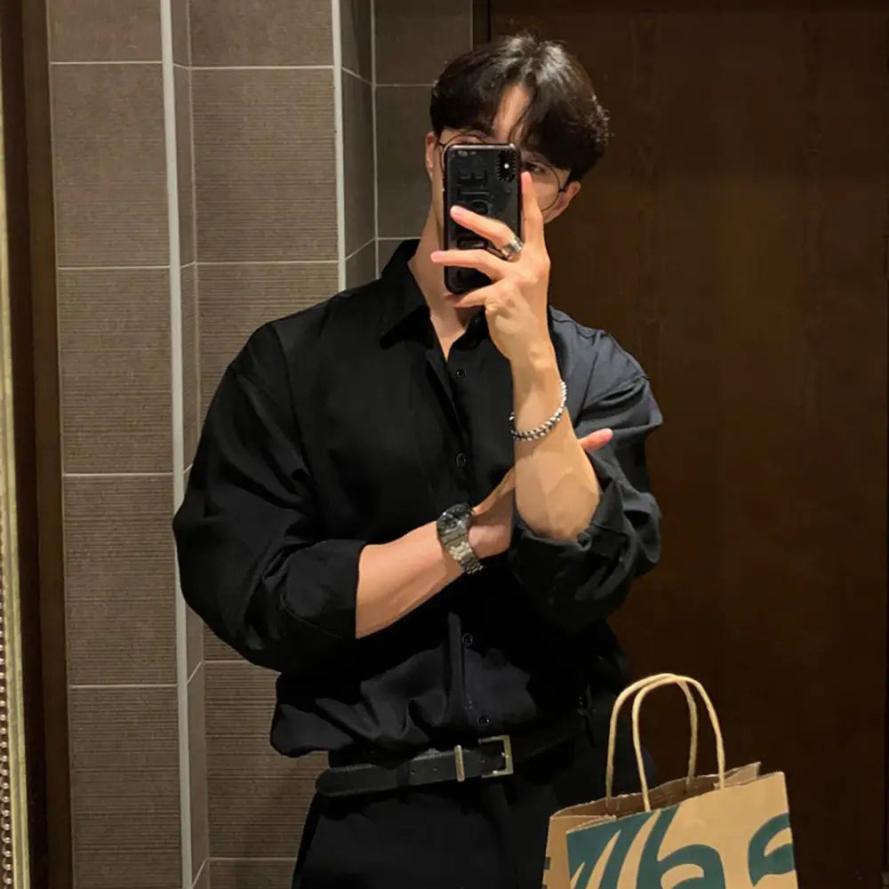 Men black long sleeve casual button down shirt with a crisp collar and subtle texture suitable for everyday wear.