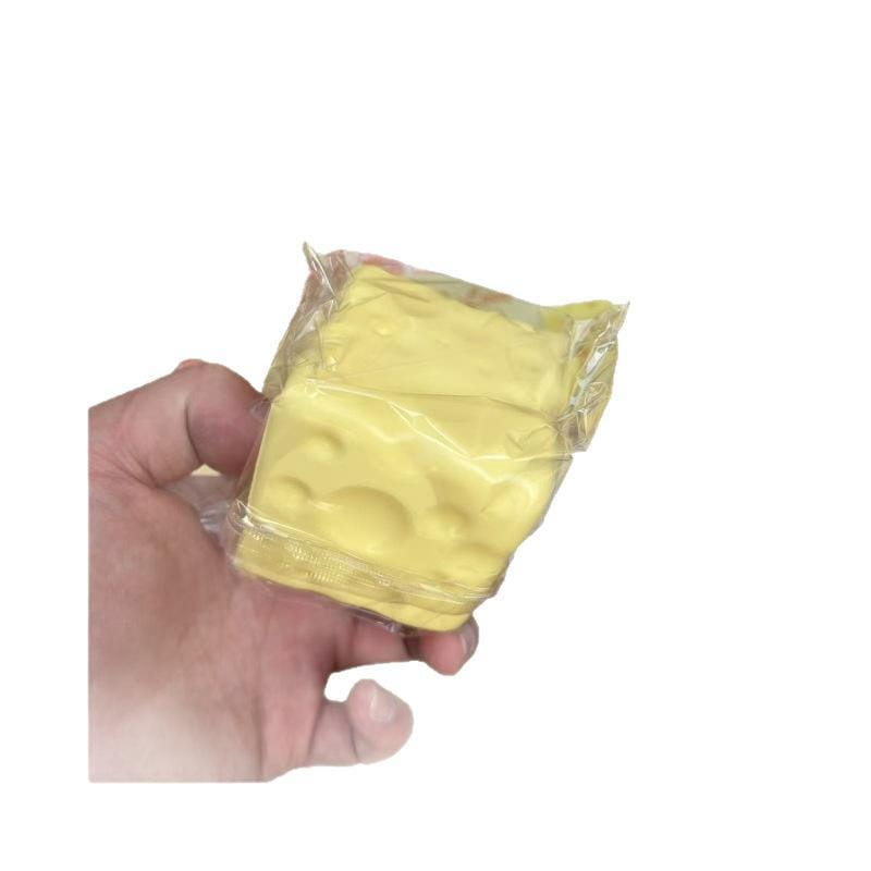 yellow cheese-shaped fidget toy made of stress relief material measuring 6cm by 6cm in clear plastic packaging