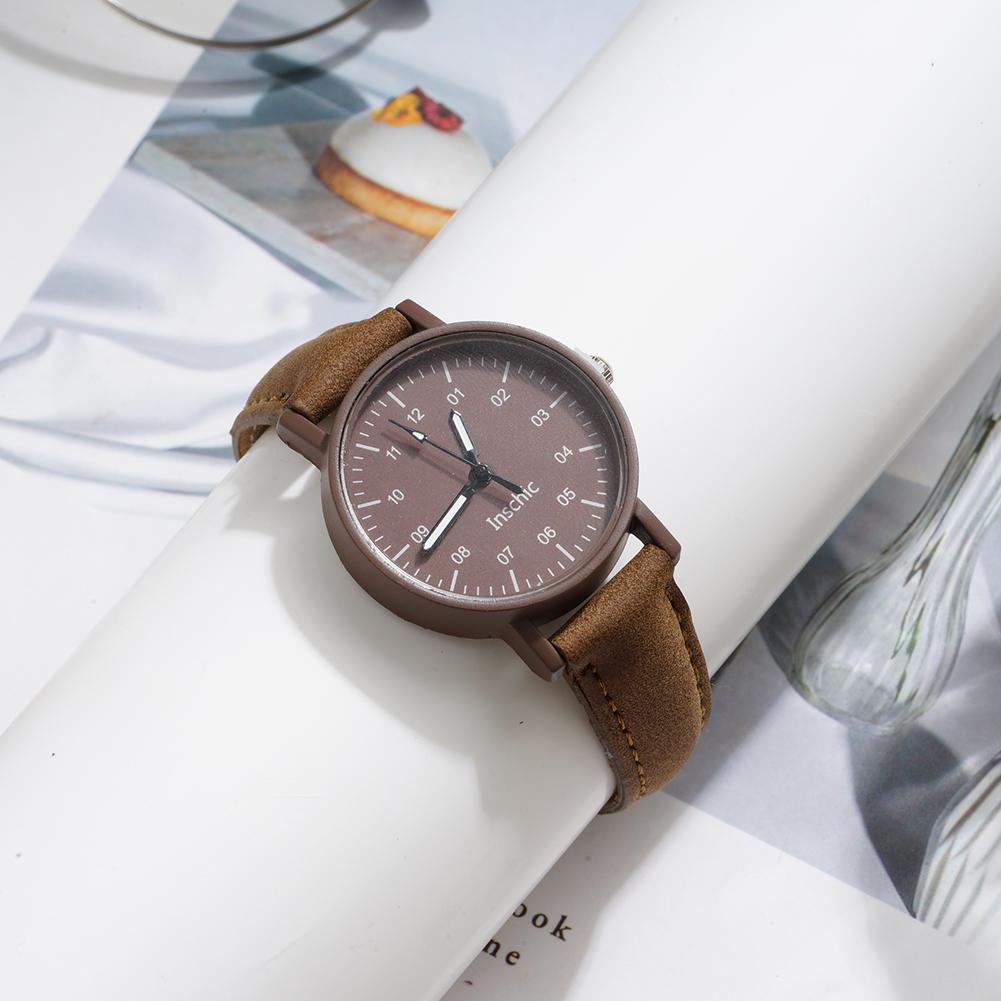 Brown wooden women quartz watch with matching brown pu leather strap and minimalist dial designed as a waterproof wristwatch.