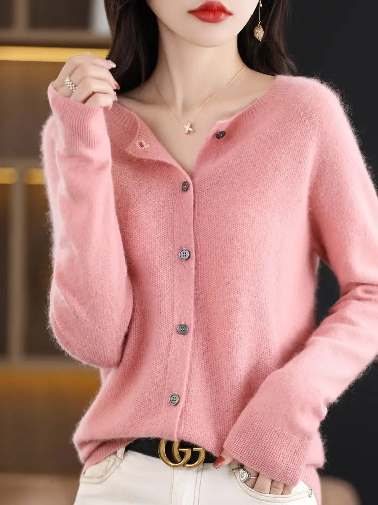 Soft pink merino wool cardigan for women with long sleeves v-neck and dark gray buttons made from cashmere knit.