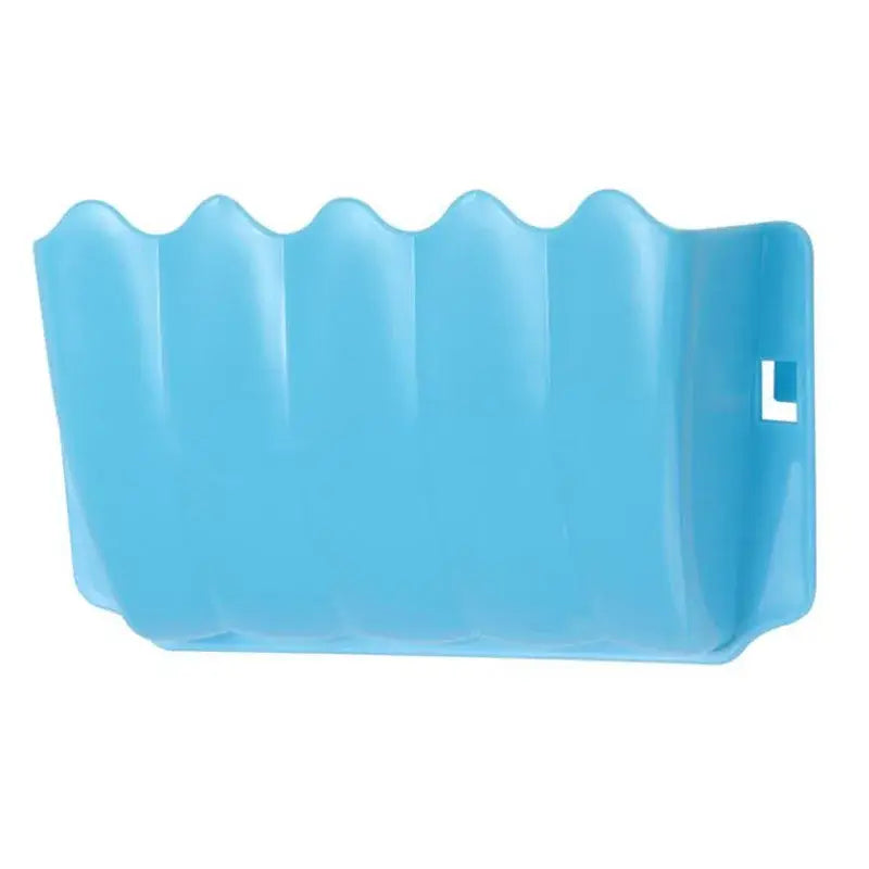 Light blue plastic bath mat with wavy scalloped edge design shown alongside an external rabbit hay feeder plastic food rack.
