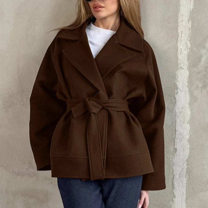 A cozy brown woolen coat with long sleeves, a belted waist, and a wide collar for women outerwear.
