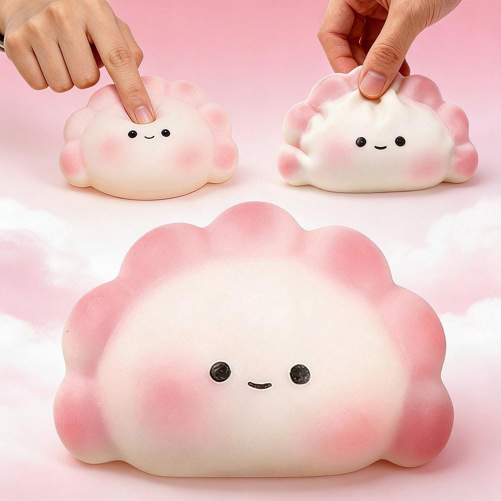 juguete exprimible para aliviar el estrés con forma de dimsum con degradado rosa y blanco, elaborado con material suave y flexible, con rasgos faciales lindos para usar como fidget