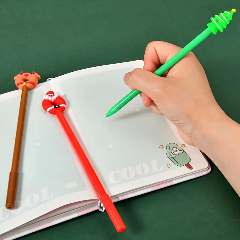 green christmas tree themed gel pen with plastic body and metallic tip from christmas gel pens 12 pack festive holiday stationery for holiday writing and drawing.