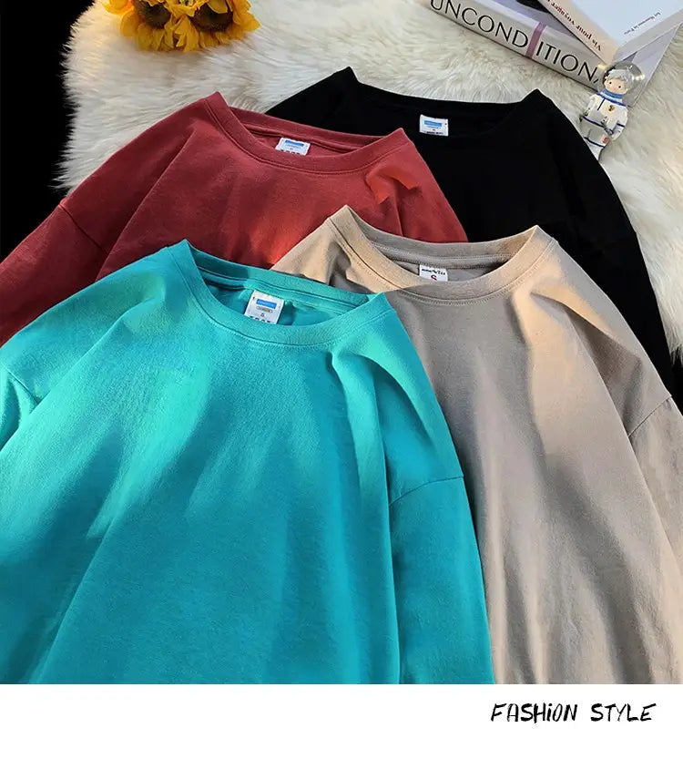 A soft oversized long sleeve blank t-shirt in vibrant teal with a relaxed fit and subtle ribbed collar.
