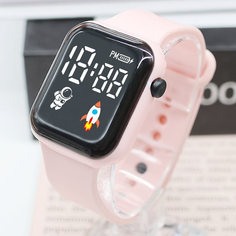 Montre électronique avec bracelet en silicone rose pour enfants, garçons et filles, avec cadran carré noir affichant des icônes liées au temps et à l’espace, idéale pour le sport et un usage quotidien