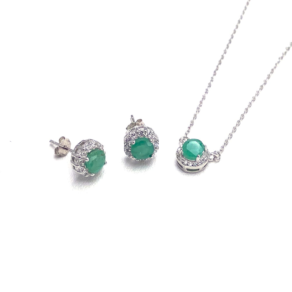 Set of elegant emerald and diamond stud earrings with a matching pendant necklace crafted in sterling silver for the emerald sterling silver jewelry set.