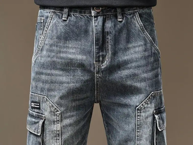 Baggy dark wash denim cargo shorts with large flap pockets and a black label on the left thigh.