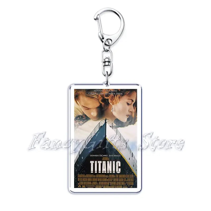 silver rectangular acrylic keychain featuring a printed titanic movie poster with leonardo dicaprio and kate winslet from the movie poster acrylic keychain set
