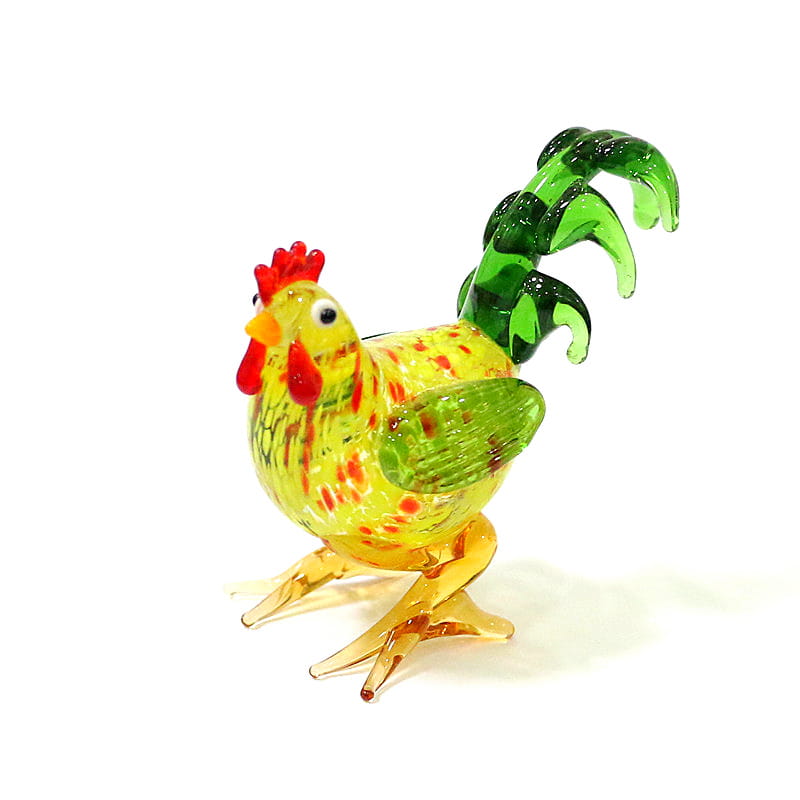 Vibrant yellow glass rooster miniature figurine with red comb and wattle green wings and tail feathers and orange legs suitable as an Easter ornament.