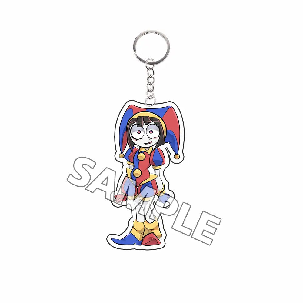 Llavero acrílico colorido del personaje caricaturesco tipo tadc con atuendo de bufón rojo, azul y amarillo, con calidad de producto terminado.