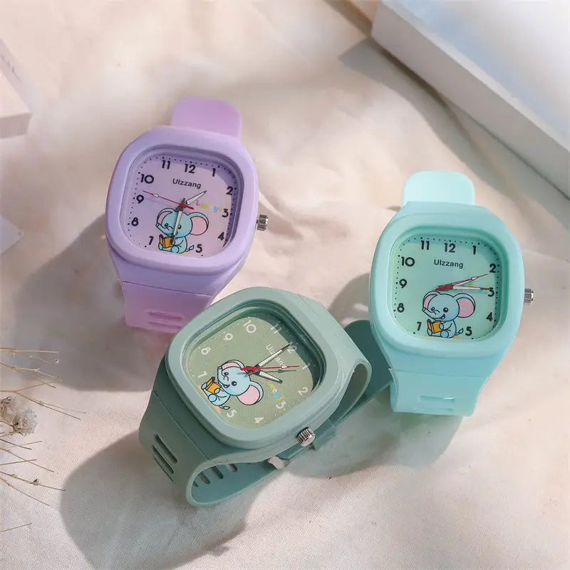 pastel-colored silicone kids luminous cartoon elephant digital wristwatch with a square face featuring a white band and an elephant holding a book design
