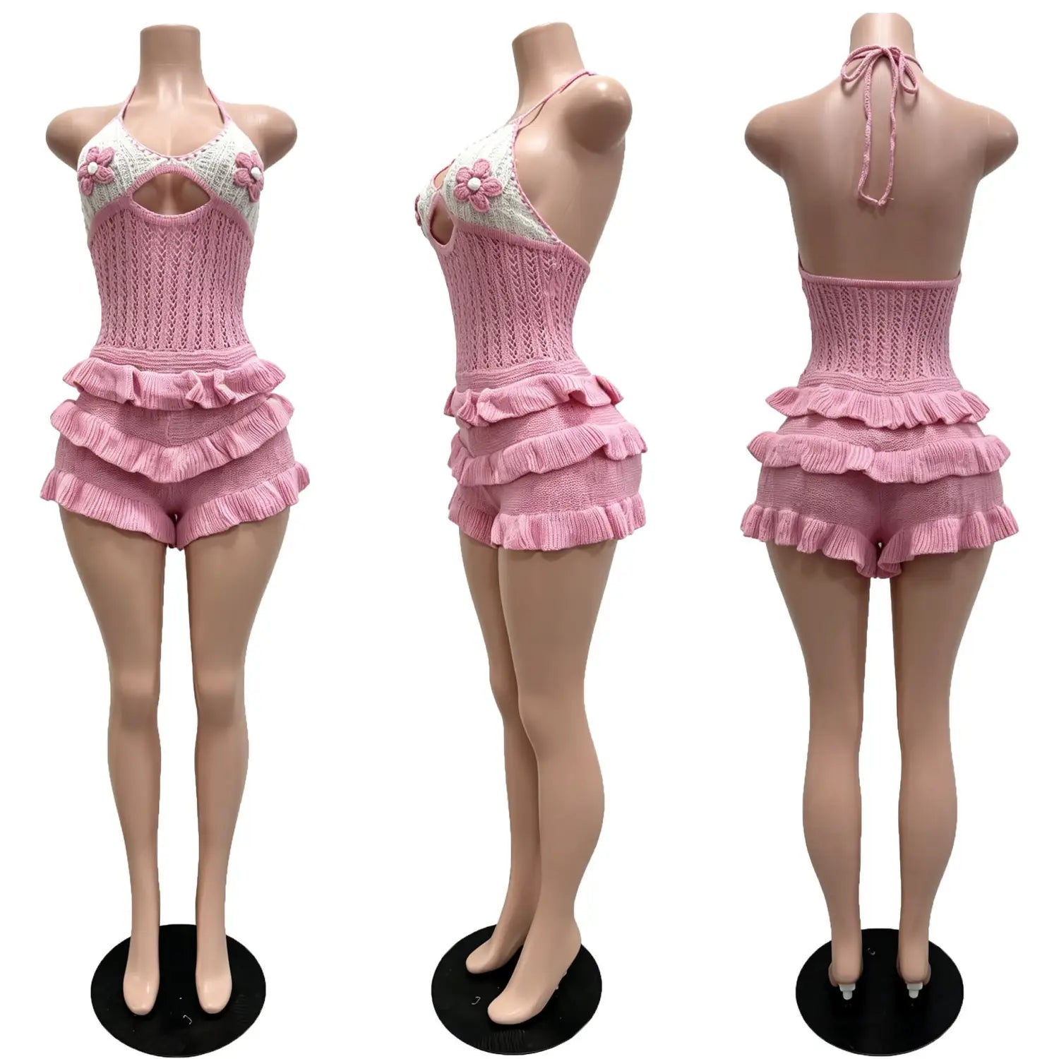 Pink knitted one-piece swimsuit with white floral embellishments and tiered ruffle shorts in a knitted ruffle halter romper summer playsuit.