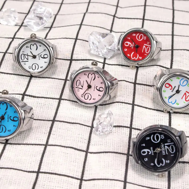 Silver-toned ring-style quartz finger couple jewelry watches with colorful white red pink blue and black faces.