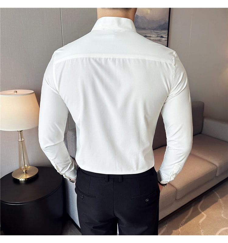 A crisp white slim fit long-sleeved dress shirt with a tailored fit and classic collar designed to ensure the correct size for formal wear.
