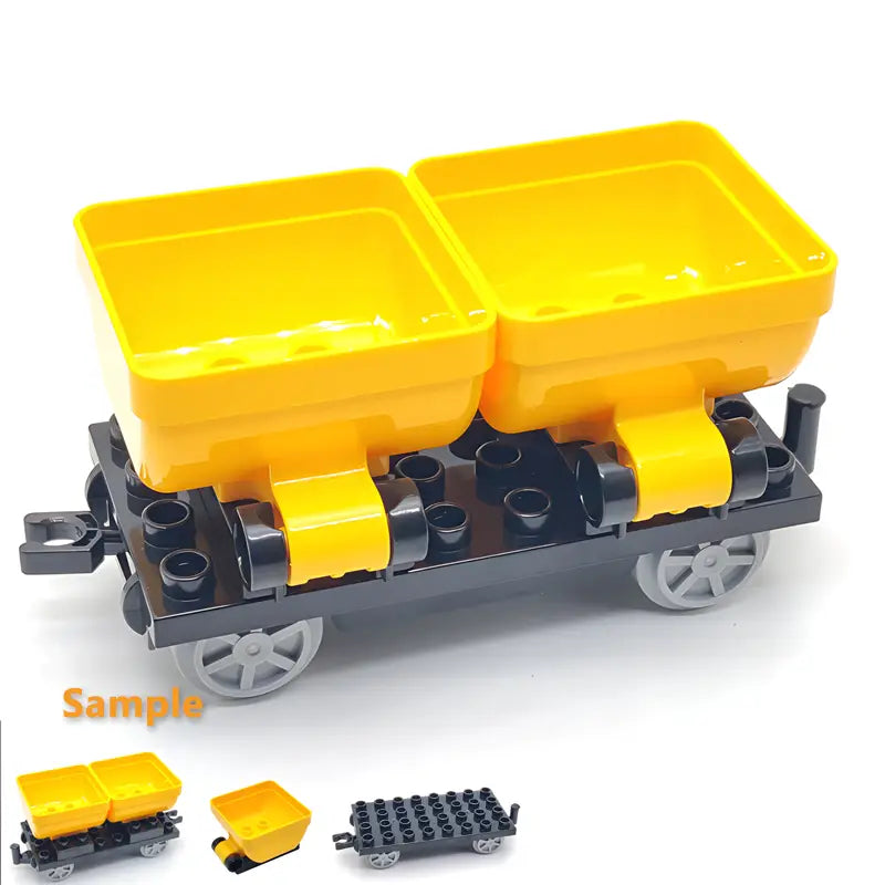 Bright yellow plastic mining cart built with black and gray lego compatible building blocks for train car toys.