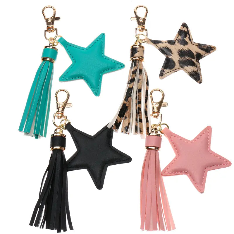 Five star leather tassel keychains for women featuring faux leather bodies in solid colors and leopard print with matching tassels and gold-tone metal clasps.