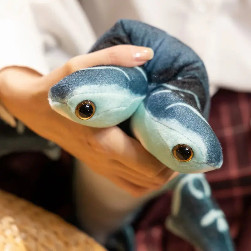 Hammerhead shark plush pillow soft toy featuring two intertwined sea turtle heads made of soft blue and teal fabric with detailed golden eyes.