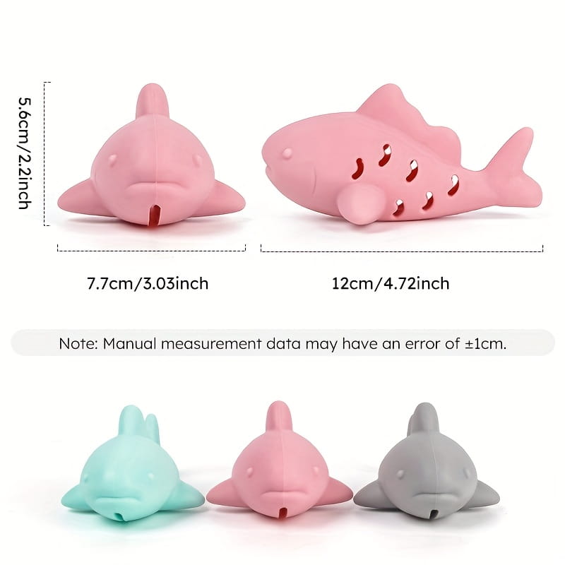 juguete dispensador de golosinas en forma de pez tipo tiburón de silicona rosa para mascotas pequeñas, con detalles de ojos rojos y una pequeña abertura en el vientre.
