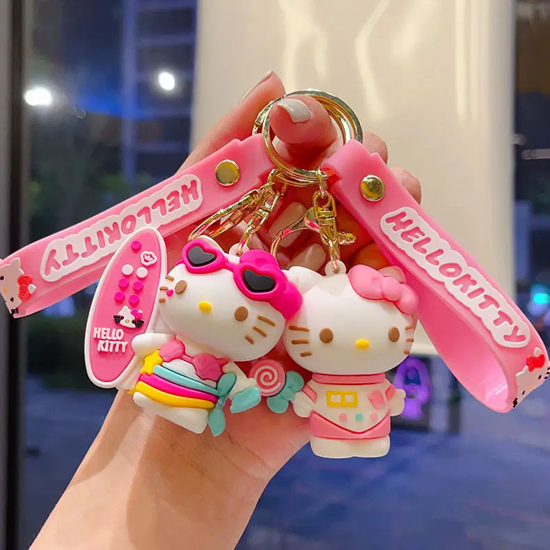 Pink silicone hello kitty cartoon keychain featuring two character figures and a matching wrist strap for use as an anime bag charm.