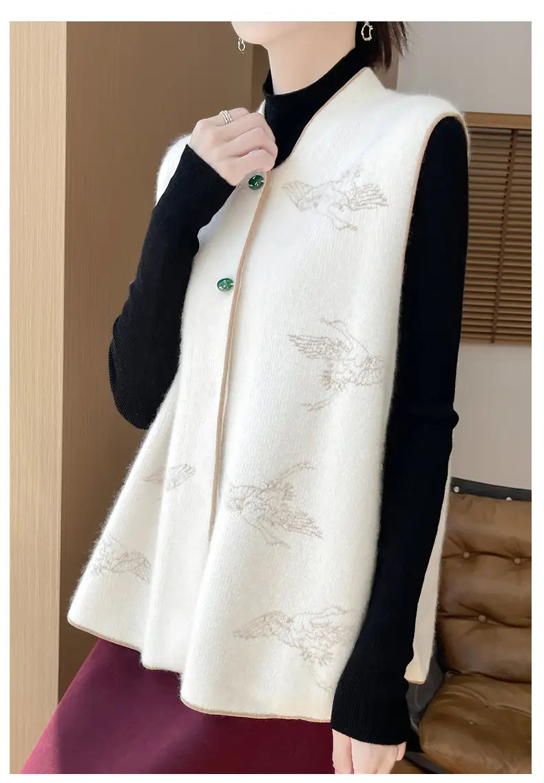 Cream-colored wool embroidered vest for women featuring softly textured knit fabric with delicate silver-toned bird embroidery and matching green buttons.