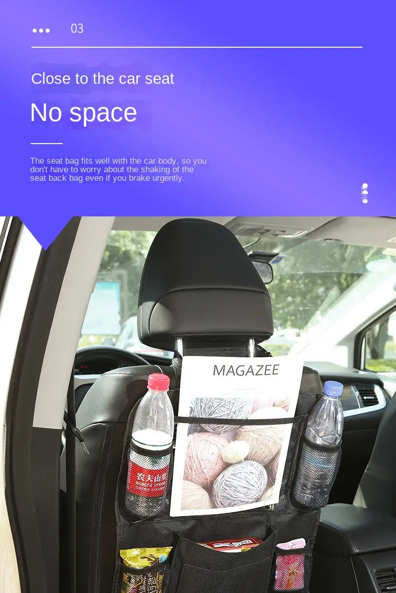 Black fabric car backseat organizer with multiple pockets and tablet holder shown from the back side holding water bottles and a magazine.